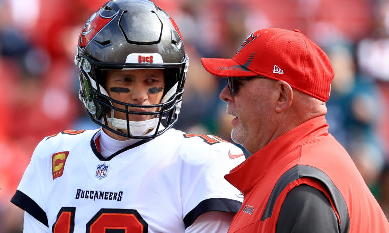 Tom Brady and Bruce Arians on the field.