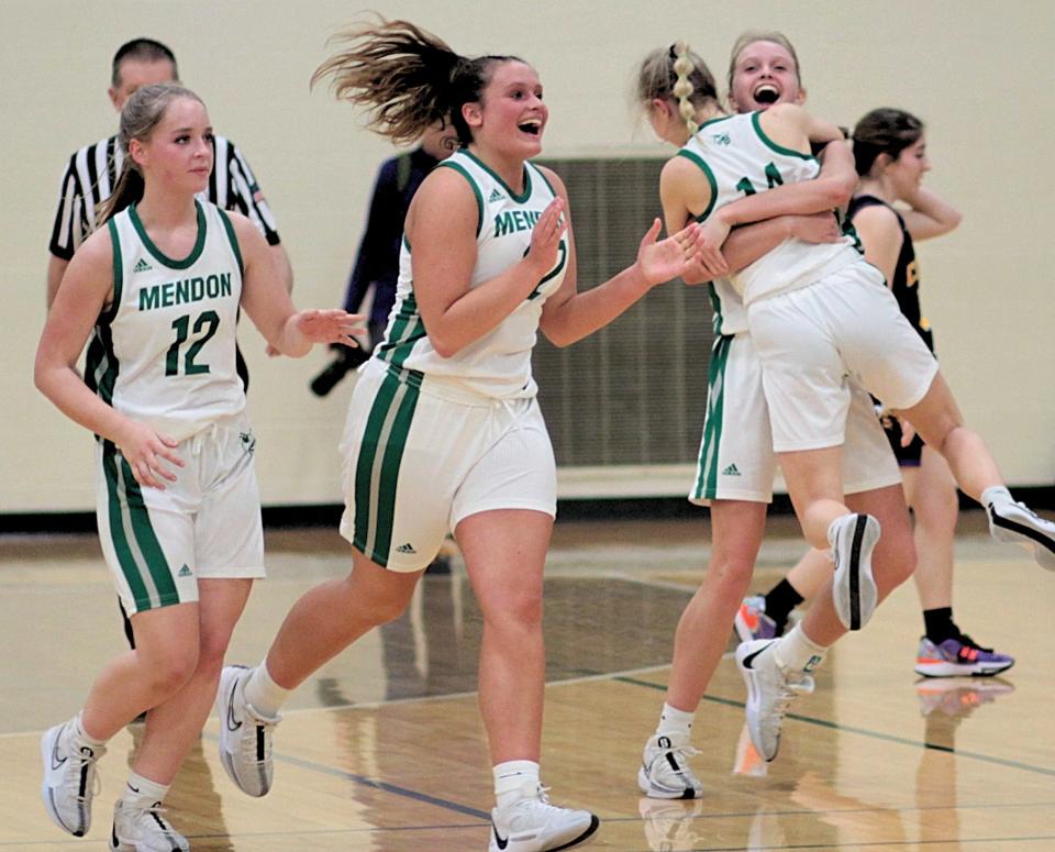 Mendon players celebrate after the final seconds came off the clock in the regional finals on Wednesday.