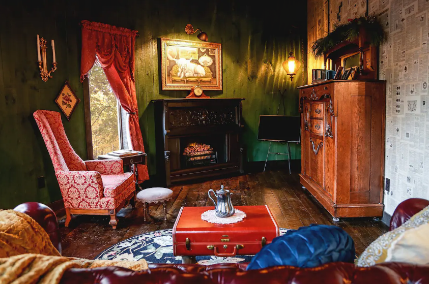 A Murphy Bed, right, is available in the living room of Sassafrass Silo Treehouse, an Airbnb rental property in Eagle Rock, Missouri. The one-bedroom, one-bathroom treehouse is located near Table Rock State Park.