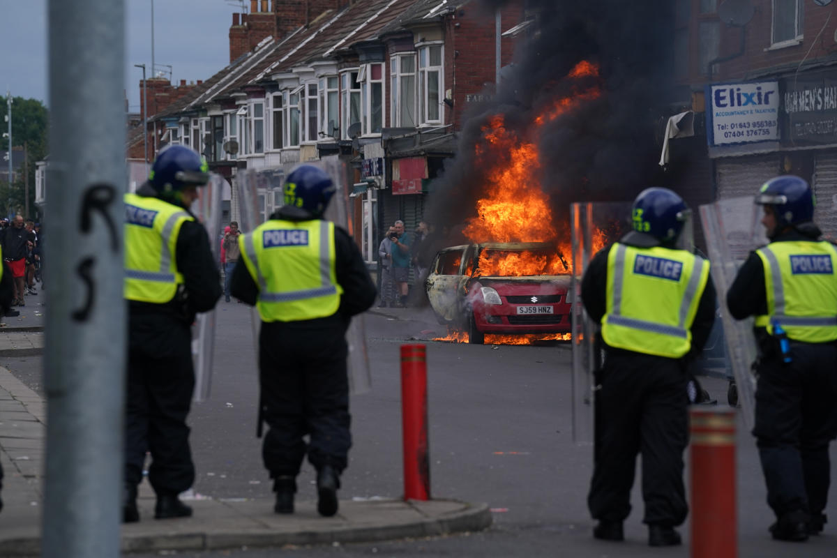 Which countries have issued travel warnings to citizens over UK riots?