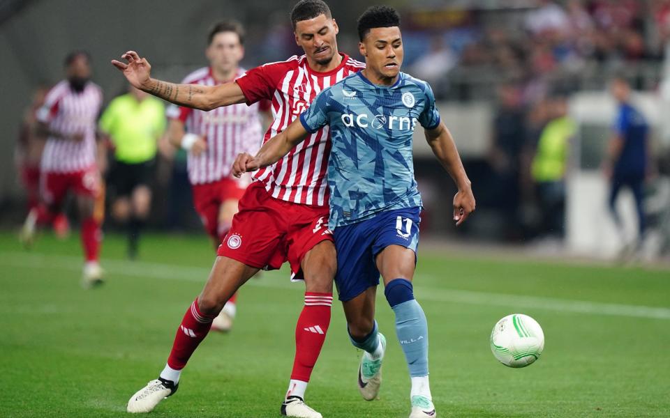 David Carmo challenges Ollie Watkins for the ball