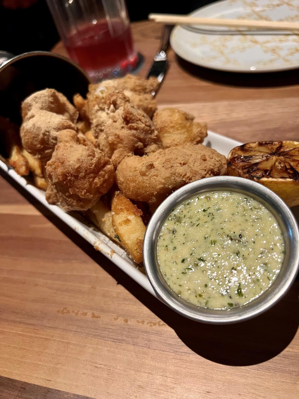 The "cheeks & chips" dish, fried halibut cheeks and French fries, at Harper's Nashville steakhouse on Nov. 13, 2023