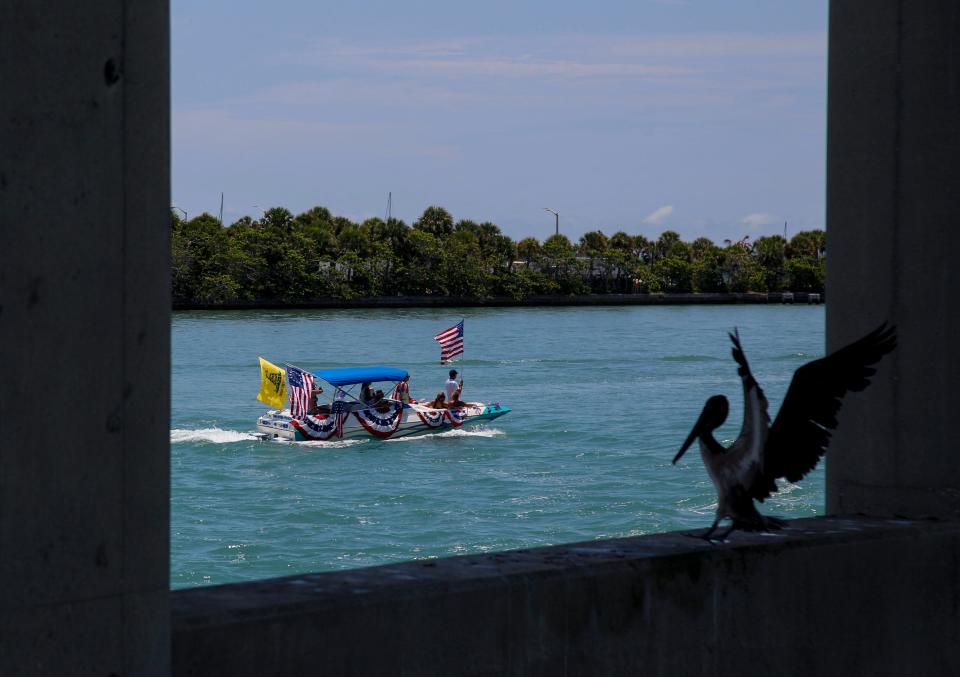 Boats, decorated in red, white and blue, participate in the Fort Pierce Yacht Club’s 13th annual Patriotic Boat Parade on the Indian River Lagoon, Tuesday, July 4, 2023. It began at the turning basin just north of the South Causeway Bridge. It was one of many Independence Day events on the Treasure Coast, and one of several in St. Lucie County, including  Stars Over St. Lucie in Fort Pierce, Freedomfest in Port St. Lucie, Tradition’s 4th of July Celebration, and fireworks with the St. Lucie Mets.