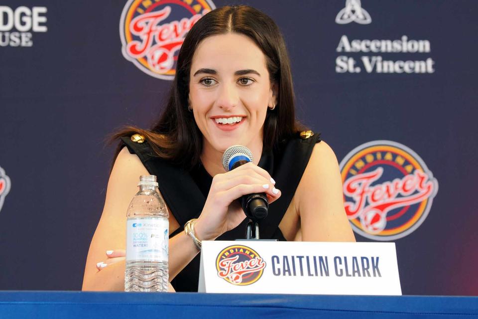 <p>Ron Hoskins/NBAE via Getty</p> Caitlin Clark of the Indiana Fever talks to the media during an introductory press conference on April 17, 2024 at Gainbridge Fieldhouse in Indianapolis, Indiana.