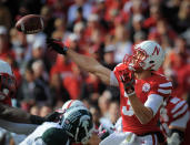 LINCOLN, NE - OCTOBER 29: Quarterback Taylor Martinez #3 of the Nebraska Cornhuskers throws downfield against the Michigan State Spartans defense during their game at Memorial Stadium October 29, 2011 in Lincoln, Nebraska. Nebraska defeated Michigan State 24-3. (Photo by Eric Francis/Getty Images)