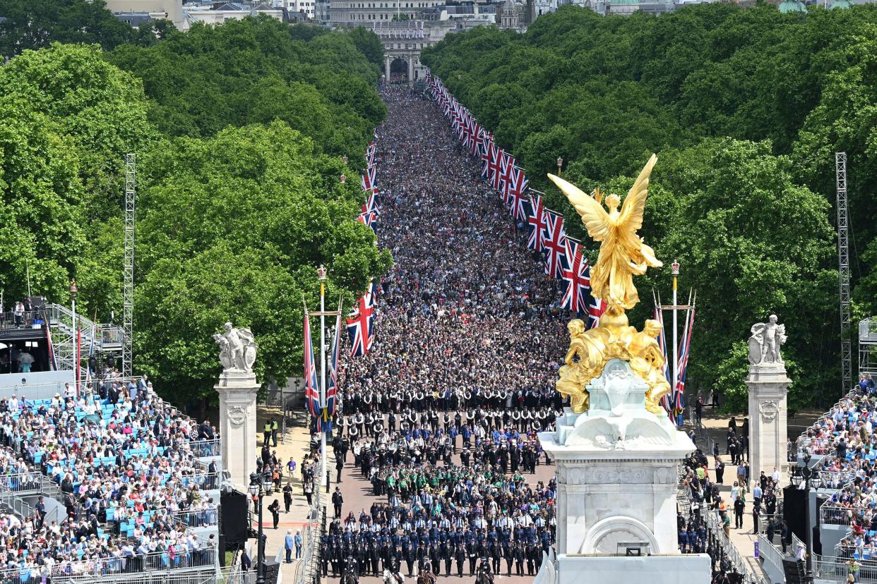 Members of the public fill The Mall ahead of a fly-past over Buckingham Palace during Trooping The Colour on June 2, 2022, in London, England.