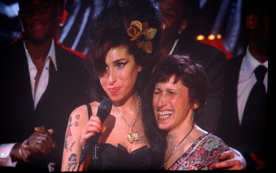 Amy with her mother Janis in 2008 at the Grammys after winning Record of the Year - Getty Images