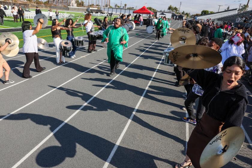 Inglewood, CA, Thursday, June 6, 2024 - Senior Alex Victorio struts during Inglewood High's "Breakdown" at the school's graduation ceremony. Band director Joseph Jaruegui, has transformed the school's band program over the course of a year, reviving a program that plateaued after the pandemic and the former band director's retirement. He managed to help graduating seniors scholarships to college. (Robert Gauthier/Los Angeles Times)