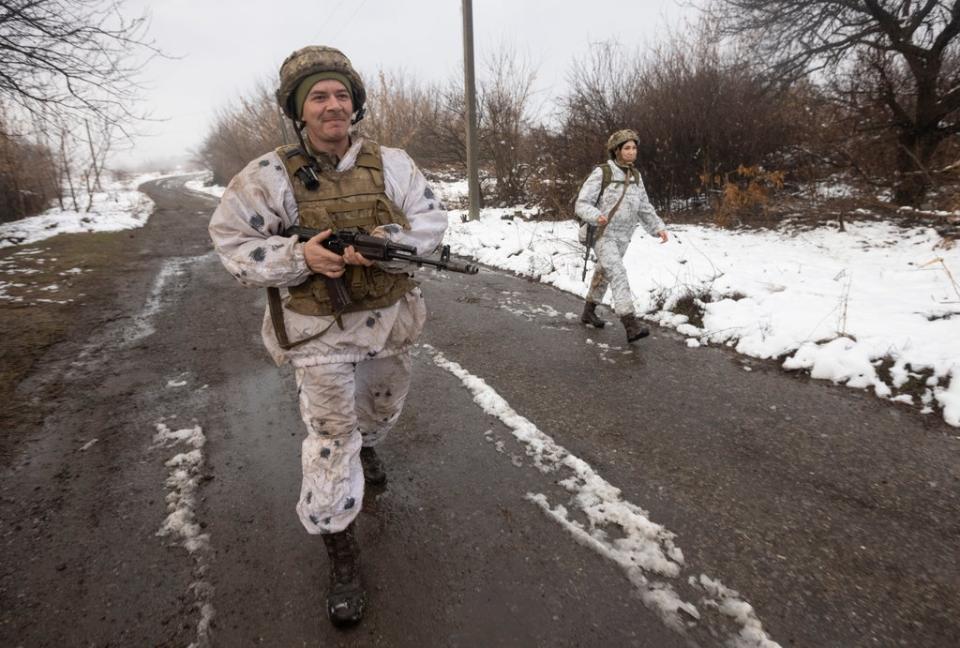 Ukrainian soldiers walks at the line of separation from pro-Russian rebels near Katerinivka, Donetsk region, Ukraine (Andriy Dubchak/AP) (AP)