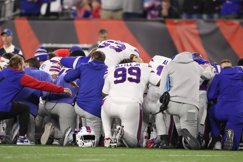 Members of the Buffalo Bills pray on the field after safety Damar Hamlin (3) was taken off the field in an ambulance. (Photo by Ian Johnson/Icon Sportswire via Getty Images)