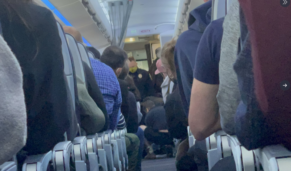 The passenger reportedly tried to open the cabin door of an American Airlines plane mid-flight. Source: Twitter/@SoccerMouaz