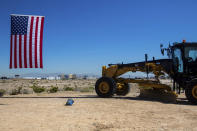 The Las Vegas strip is shown behind the groundbreaking sight of a high-speed passenger rail line between Las Vegas and the Los Angeles on Monday, April 22, 2024, in Las Vegas. A $12 billion high-speed passenger rail line between Las Vegas and the Los Angeles area has started construction. (AP Photo/Ty ONeil)