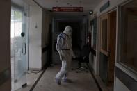 Medical workers treat patients infected with the coronavirus disease (COVID-19) at a hospital in New Delhi