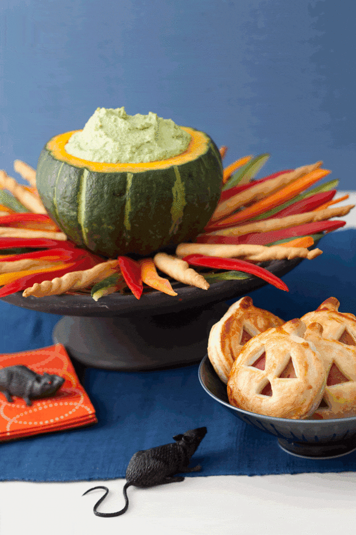 <p>What's a Halloween party without a good dip? Made from good-for-you edamame and low-fat ricotta cheese, serve dip in a large acorn squash atop a "fire" of crudité and breadsticks.<br></p><p><a href="https://www.womansday.com/food-recipes/food-drinks/recipes/a11350/cauldron-dip-recipe-122710/" rel="nofollow noopener" target="_blank" data-ylk="slk:Get the Cauldron Dip recipe." class="link rapid-noclick-resp"><em>Get the Cauldron Dip recipe.</em></a></p>