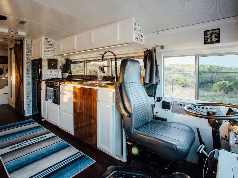 The kitchen behind the driver's seat in the Number Juan Bus