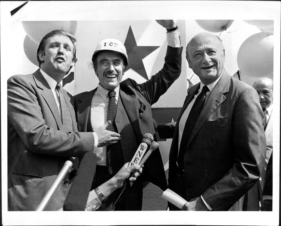 Donald Trump, his father, Fred, and New York Mayor Ed Koch celebrate the completion of Trump Tower in July 1982.