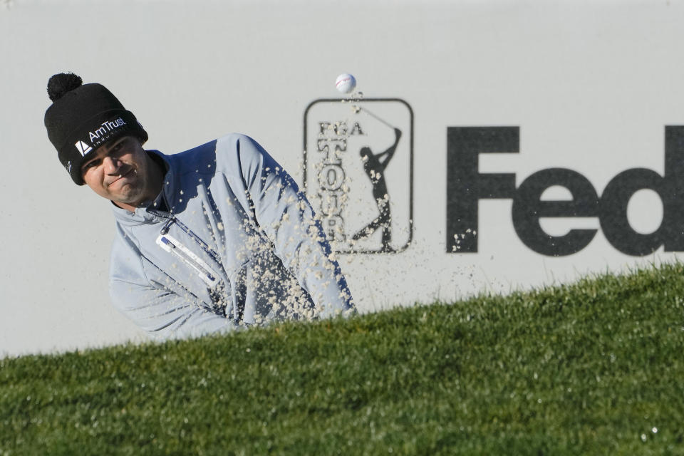 Beau Hossler follows his shot out of bunker onto the 15th green of the Pebble Beach Golf Links during the fourth round of the AT&T Pebble Beach Pro-Am golf tournament in Pebble Beach, Calif., Monday, Feb. 6, 2023. (AP Photo/Godofredo A. Vásquez)