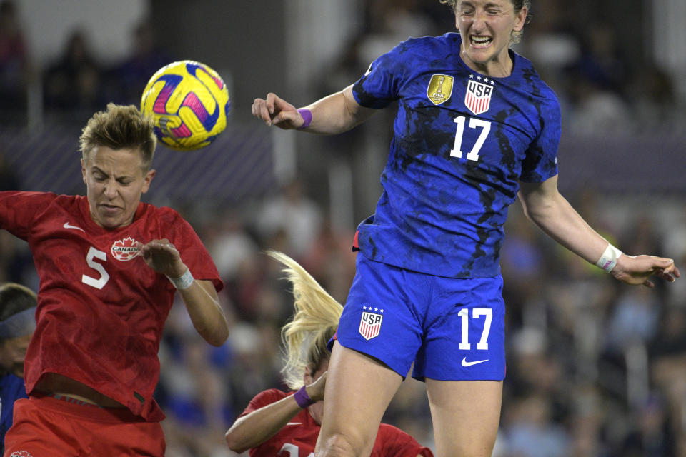 U.S. midfielder Andi Sullivan (17) and Canada midfielder Quinn compete for a head ball; during the second half of a SheBelieves Cup soccer match Thursday, Feb. 16, 2023, in Orlando, Fla. (AP Photo/Phelan M. Ebenhack)