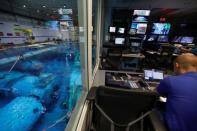 A control center looking out over the water at NASA's Neutral Buoyancy Laboratory (NBL) training facility near the Johnson Space Center in Houston