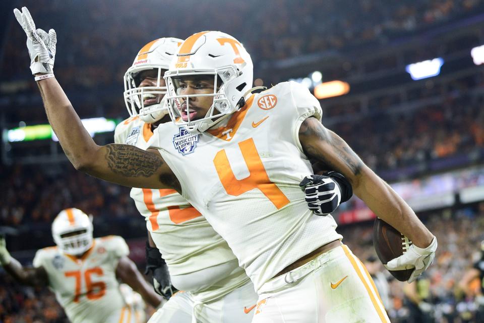Tennessee wide receiver Cedric Tillman (4) celebrates a touchdown in the 2021 Music City Bowl in Nashville, Thursday, Dec. 30, 2021.
