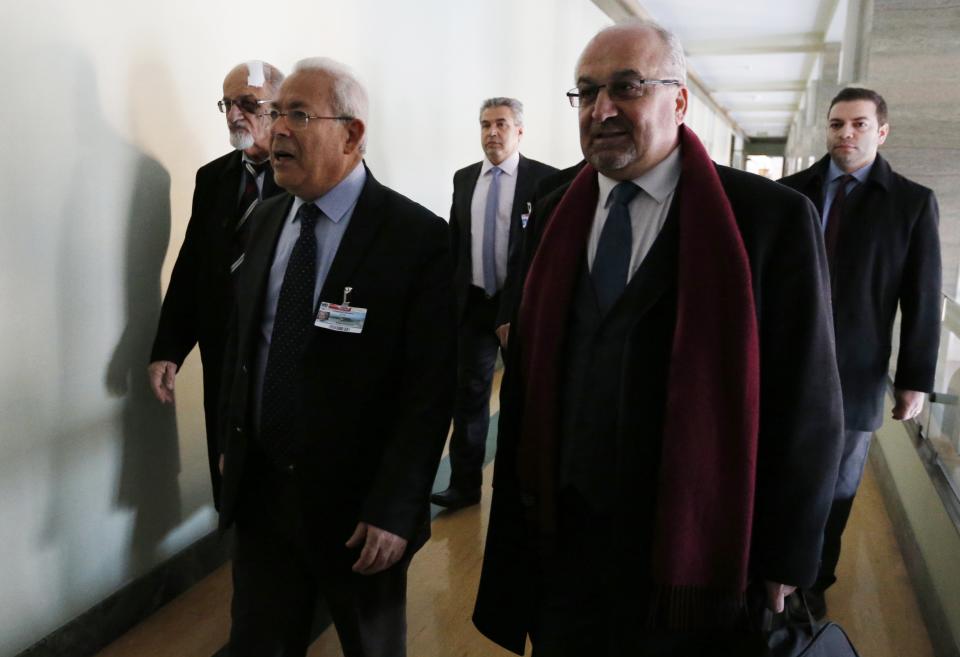 Syrian opposition delegation, Haitham al Maleh (L), Burhan Ghalioun (C) and Abdelahad Estepho (R), arrive for a meeting with U.N.-Arab League envoy for Syria Lakhdar Brahimi (not seen) at a U.N. office in Geneva January 24, 2014. (REUTERS/Jamal Saidi)