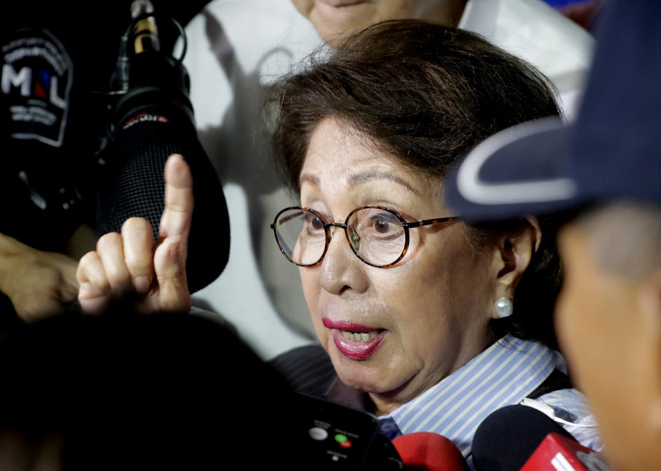 Former Philippine Supreme Court justice Conchita Carpio-Morales talks to reporters upon arrival at the Ninoy Aquino International Airport from Hong Kong where she was stopped by Immigration authorities and was held in a room at Hong Kong's airport and ordered to take a flight back to Manila, Tuesday, May 21, 2019 in suburban Pasay city south of Manila, Philippines. Carpio-Morales, along with former Foreign Affairs Secretary Albert Del Rosario, once accused Chinese President Xi Jinping of crimes against humanity before the International Criminal Court. (AP Photo/Bullit Marquez)