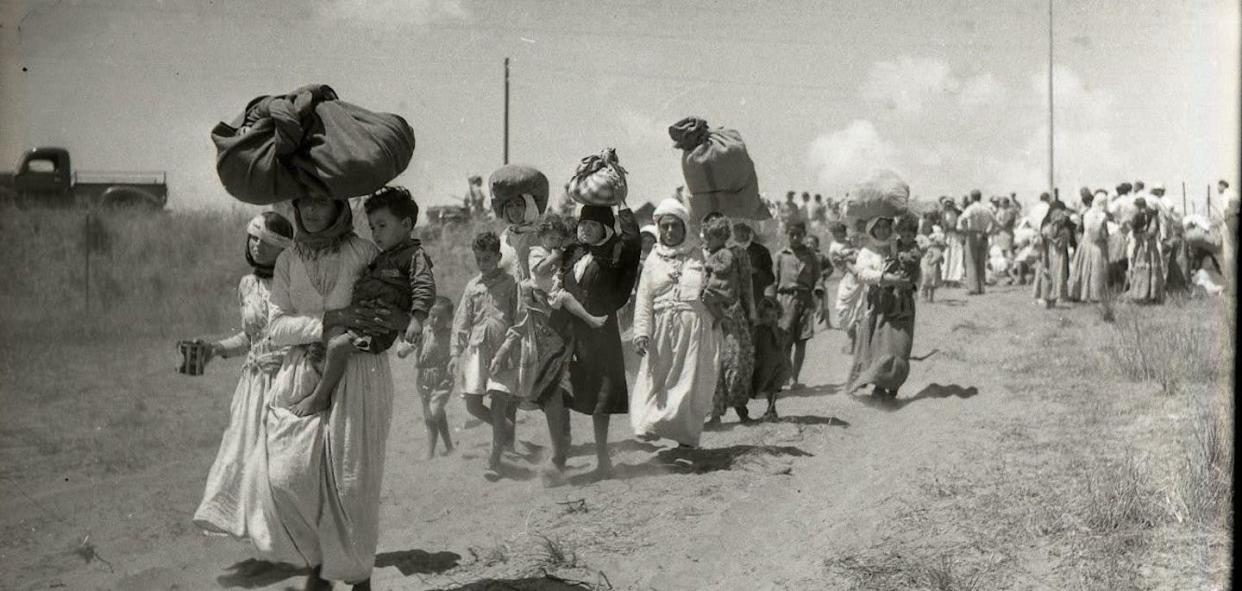 Deportation of Tantura's women and children, from Fureidis to Tulkarm, three weeks after the Israeli takeover. The documentary, Tantura, aims to shed light on the destruction of the Palestinian village in 1948. (Israel State Archive, Benno Rothenberg collection)