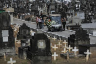 FILE - In this Jan. 7, 2021 file photo relatives attend the burial of 71-year-old Jose Abelardo Bezerra, who died from COVID-19 related complications, at the Inhauma cemetery in Rio de Janeiro, Brazil. Brazil has suffered more than 200,000 COVID-19 deaths, the second-highest total in the world after the United States, with infections and deaths surging again. (AP Photo/Bruna Prado, File)