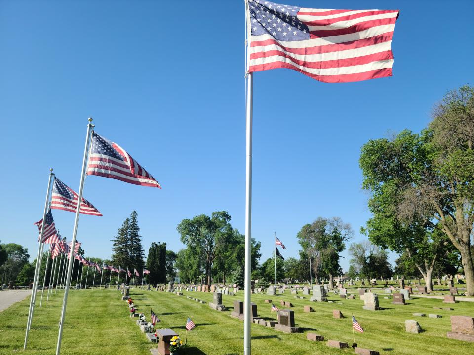 Flags fly at Violet Hill Cemetery on Friday, May 26, 2023, ahead of Memorial Day.