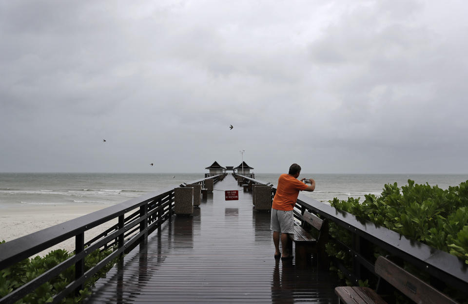 <p><strong>Naples</strong><br>Keith Gahagan takes a photo of the early effects of Hurricane Irma in Naples, Fla., Sept. 10, 2017. (Photo: David Goldman/AP) </p>