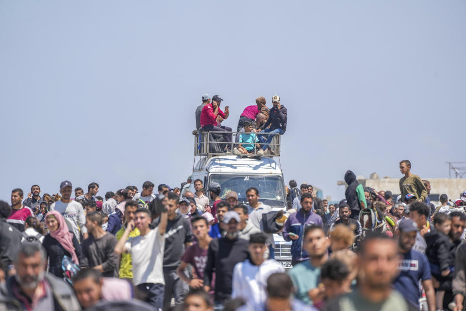 Displaced Palestinians trying to walk back from central Gaza Strip to northern Gaza Strip , Sunday, April 14, 2024. (AP Photo/Abdel Kareem Hana)