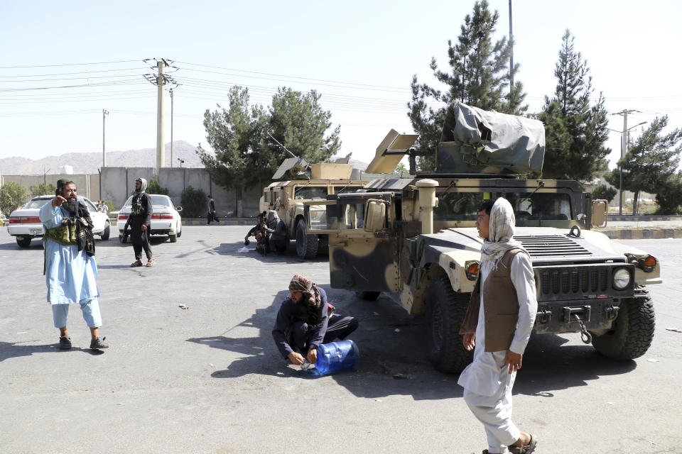 Taliban fighters stand guard outside the airport after Thursday's deadly attacks, in Kabul, Afghanistan, Friday, Aug. 27, 2021. Two suicide bombers and gunmen attacked crowds of Afghans flocking to Kabul's airport Thursday, transforming a scene of desperation into one of horror in the waning days of an airlift for those fleeing the Taliban takeover. (AP Photo/Wali Sabawoon)