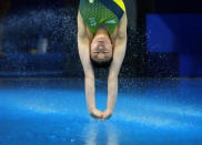 Esther Qin of Australia competes in women's diving 3m springboard preliminary at the Tokyo Aquatics Centre at the 2020 Summer Olympics, Friday, July 30, 2021, in Tokyo, Japan. (AP Photo/Dmitri Lovetsky)