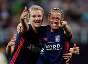 FILE PHOTO: Ada Hegerberg celebrates with team mate Camille Abily after Olympique Lyonnais' fourth goal against Vfl Wolfsburg in the Women's Champions League final.