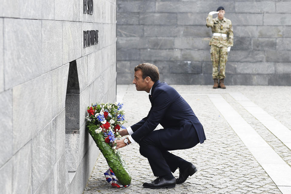 French President Emmanuel Macron attends a wreath laying ceremony with Denmark's Crown Prince Frederik, at the Citadel of Copenhagen, in honor of fallen Danish soldiers on international missions, Tuesday Aug. 28, 2018. French President Emmanuel Macron is on a two-day visit, hoping to build the relationships he needs to push France's agenda of a more closely united European Union. (Liselotte Sabroe/Ritzau Scanpix via AP)
