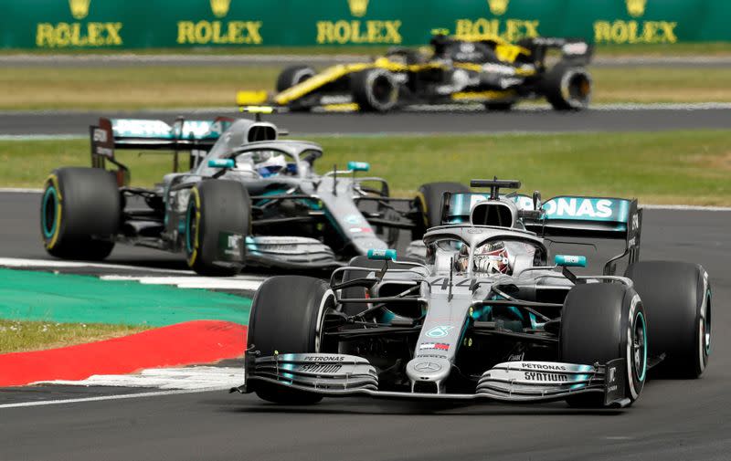 FILE PHOTO: Mercedes' drivers Lewis Hamilton and Valtteri Bottas in action at the 2019 British Grand Prix at Silverstone
