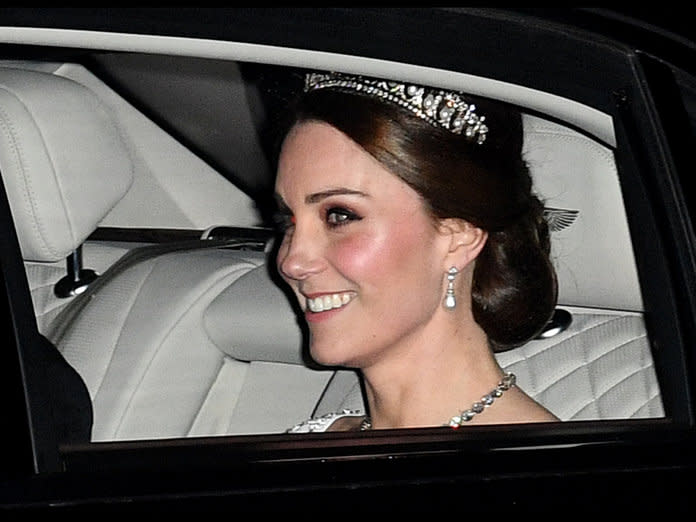 The royal stepped out to an even with her husband Prince William while wearing his late mother's tiara and a bridal white outfit.