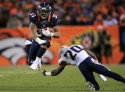 DENVER, CO - NOVEMBER 18: Running back Lance Ball #35 of the Denver Broncos rushes for a first down as he eludes cornerback Antoine Cason #20 of the San Diego Chargers at Sports Authority Field at Mile High on November 18, 2012 in Denver, Colorado. The Broncos defeated the Chargers 30-23. (Photo by Doug Pensinger/Getty Images)