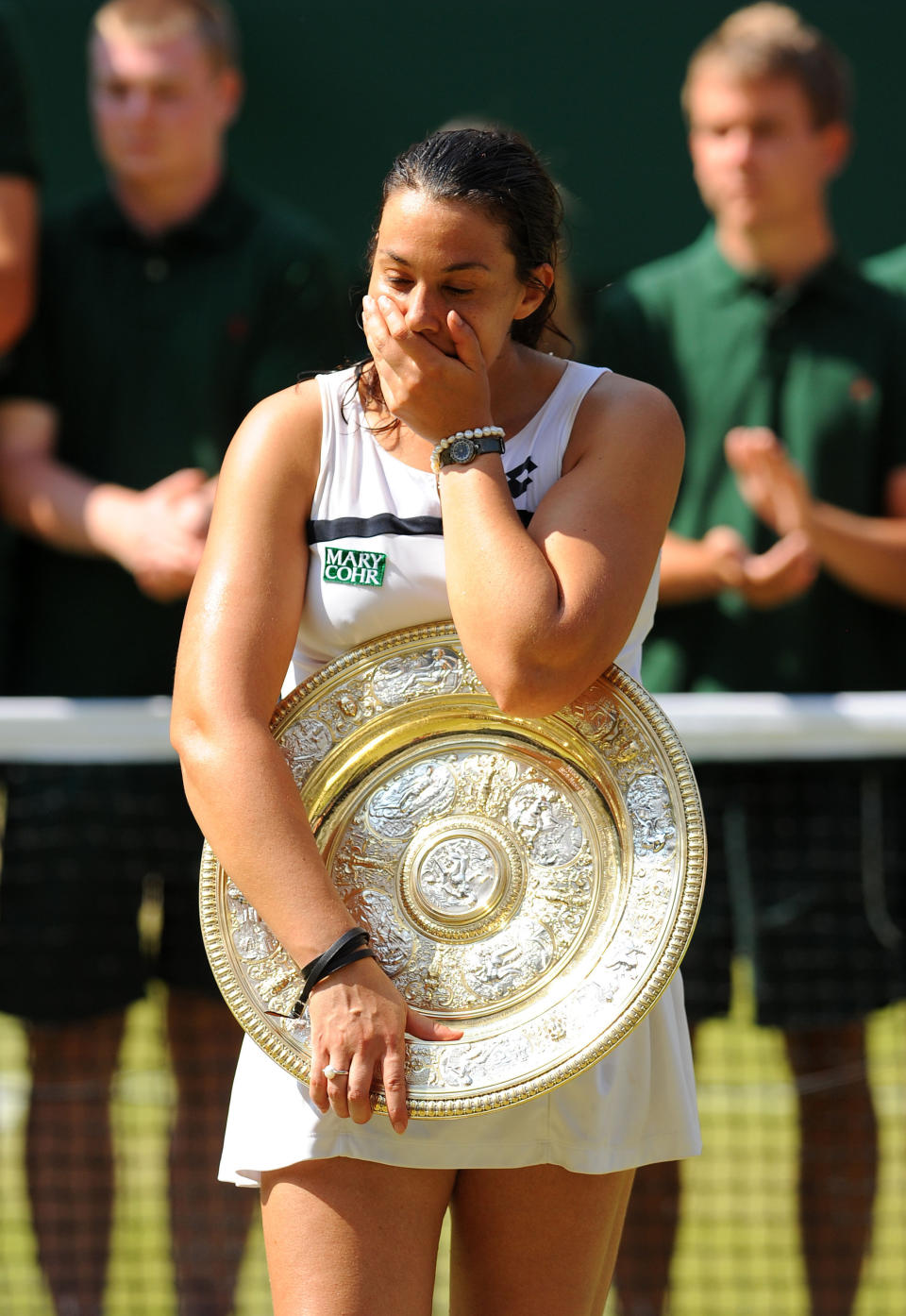 France's Marion Bartoli celebrates with her trophy after defeating Germany's Sabine Lisicki in the Ladies' Singles Final during day twelve of the Wimbledon Championships at The All England Lawn Tennis and Croquet Club, Wimbledon.