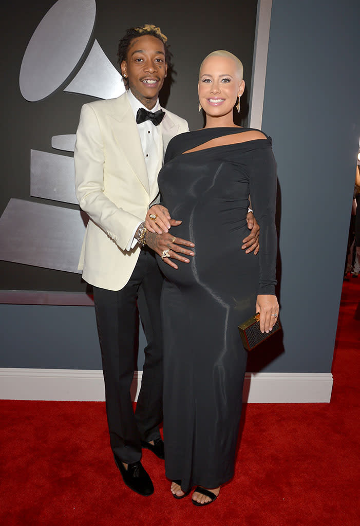 <b>Wiz Khalifa and Amber Rose</b><br> <b>Grade: B+</b><br> Expectant parents Wiz Khalifa and Amber Rose (she’s due to give birth in three weeks!) got all gussied up for the Grammys. While the rapper opted for a black-and-white Tom Ford ensemble, Amber showed off her baby bump in a black Donna Karan design.