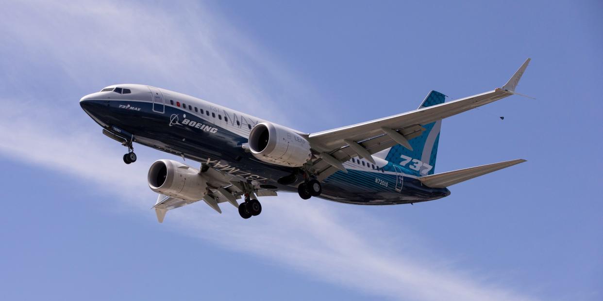 FILE PHOTO: A Boeing 737 MAX airplane lands after a test flight at Boeing Field in Seattle, Washington, U.S. June 29, 2020. REUTERS/Karen Ducey