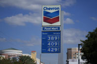 Signage is seen at a Chevron gas station, Monday, Oct. 23, 2023, in South Miami, Fla. (AP Photo/Rebecca Blackwell)