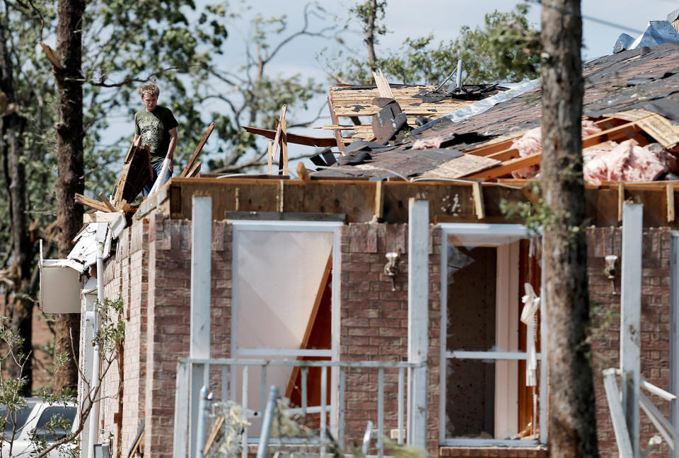 Homeowner takes stock of damage to his home