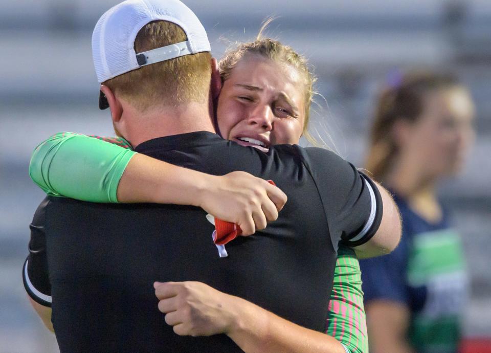 Peoria Notre Dame goaltender Addie Jennetten hugs one of her coaches after the Irish fell 1-0 in overtime to Benet Academy in the Class 2A Washington Supersectional soccer match Tuesday, May 30, 2023 in Washington.