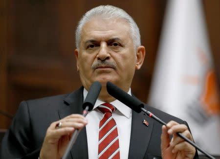 Turkey's Prime Minister Binali Yildirim addresses members of parliament from his ruling AK Party (AKP) during a meeting at the Turkish parliament in Ankara, Turkey, November 8, 2016. REUTERS/Umit Bektas