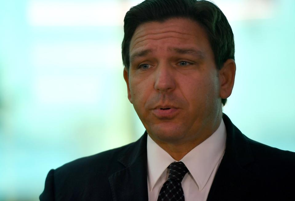 Gov. Ron DeSantis answers questions from a reporter during a press conference in Sarasota on Friday.