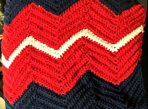 Every Indians player, coach and television broadcaster received a hand-crocheted afghan with the team's colors. (Indians on Twitter)