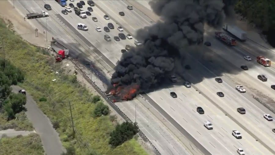 A very large fire tore through a semi-truck on the 5 Freeway on Wednesday afternoon, sending thick plumes of black smoke into the sky and causing heavy traffic delays. (Sky5)