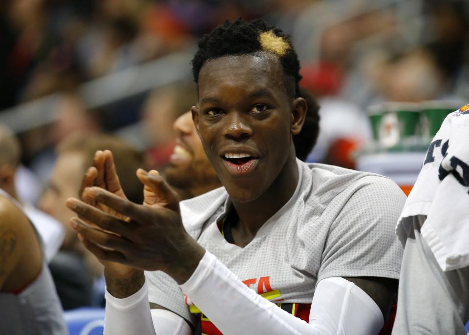 Dennis Schröder claps on the bench. He'll be doing a lot of that on Friday. (AP)