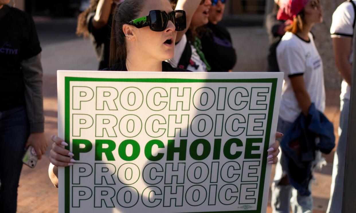 <span>Protesters at a rally led by Women's March Tucson in Tucson, Arizona, on Tuesday.</span><span>Photograph: Rebecca Noble/Reuters</span>